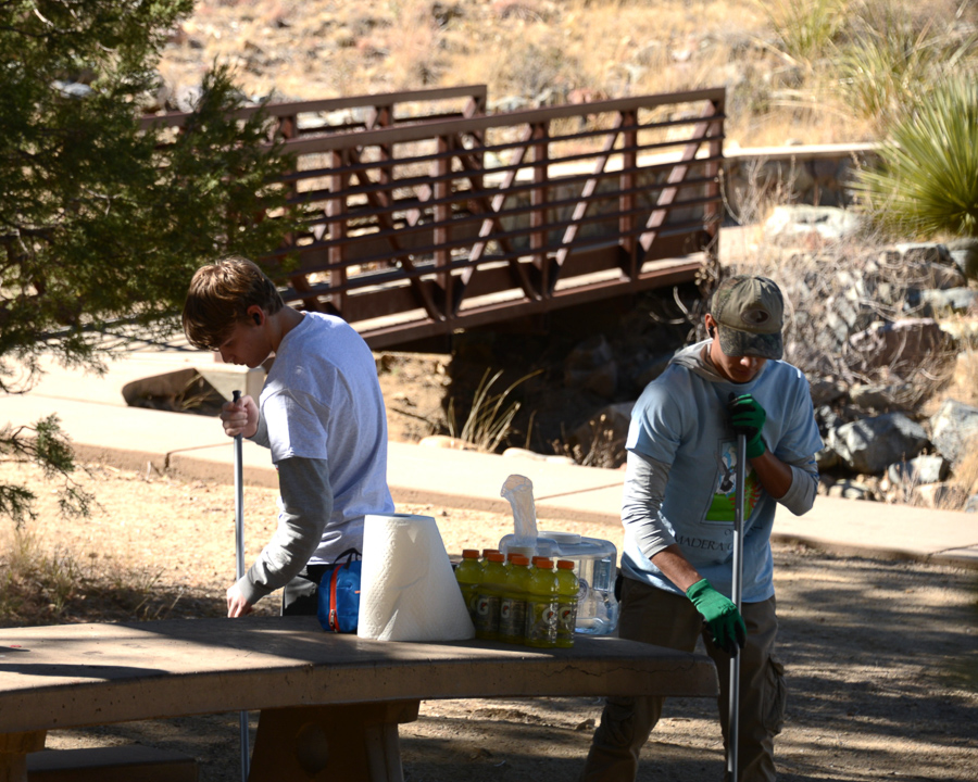 Volunteers cleaning a picnic table